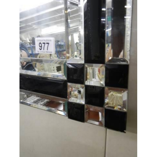 977 - A modern black and clear bevelled mirror, COLLECT ONLY.