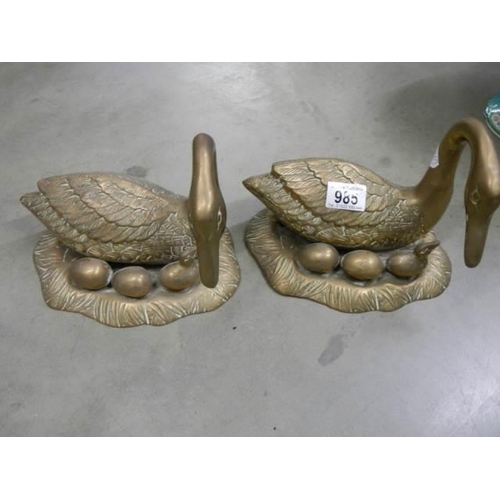 985 - A pair of heavy brass ducks.