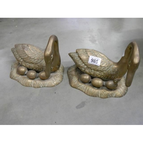 985 - A pair of heavy brass ducks.