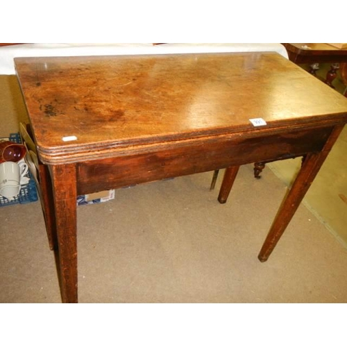 991 - A mahogany fold over card table, COLLECT ONLY.