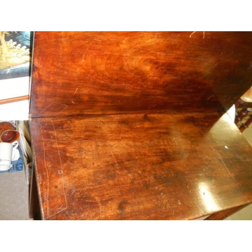 991 - A mahogany fold over card table, COLLECT ONLY.