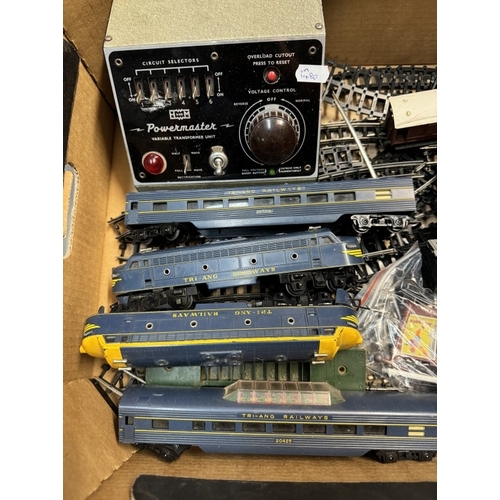 83 - A box of Tri-ang 'OO' railways engines, coaches and rolling stock with track