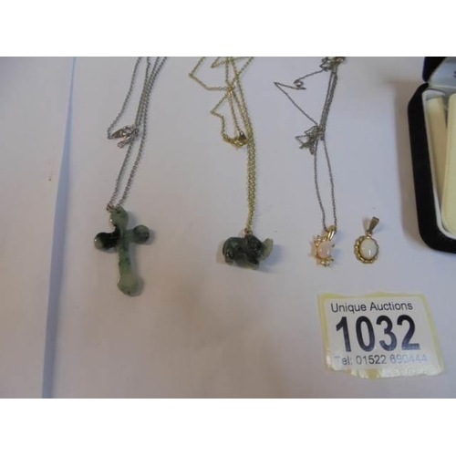 1032 - A crystal pendant on silver chain, two jade pendants, 2 other pendants and 2  bracelets.