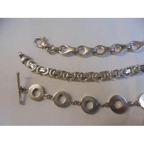 1037 - Three silver bracelets, 91.7 grams.