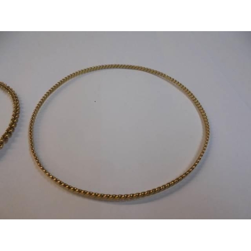 1043 - Two 9ct gold bangles, 9.2 grams.