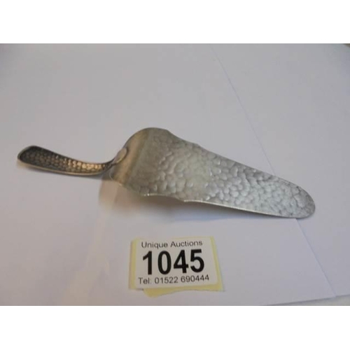 1045 - A WMF hammered metal cake slice.