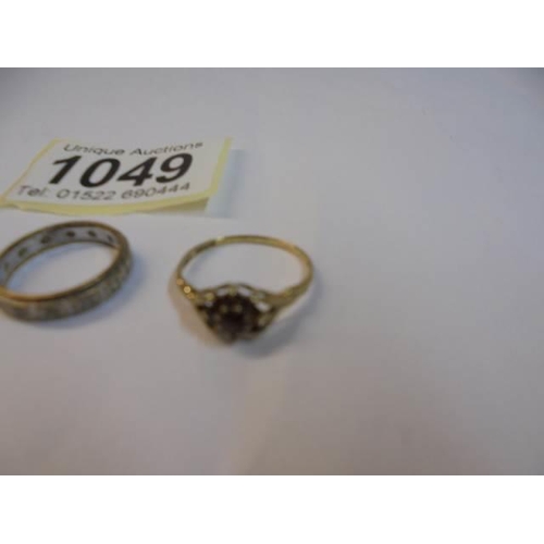 1049 - Two 9ct gold rings, sizes K & L and a 9ct gold eternity ring size J. 4.4 grams.