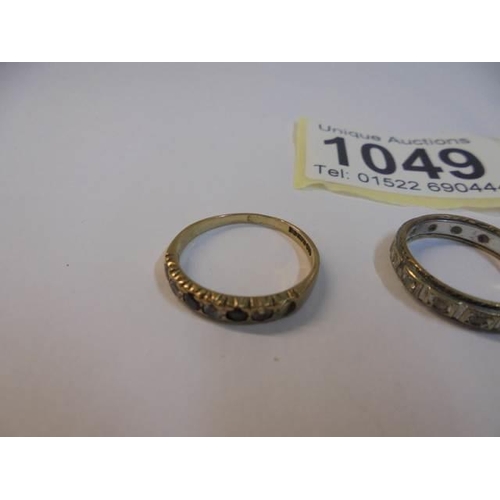 1049 - Two 9ct gold rings, sizes K & L and a 9ct gold eternity ring size J. 4.4 grams.