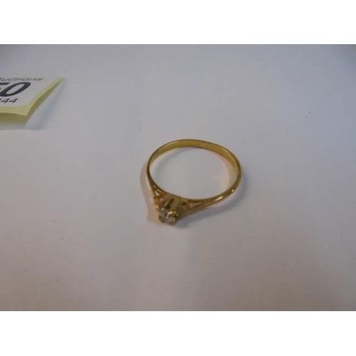 1050 - Two yellow metal rings, a white metal ring and a tiny yellow metal ring.