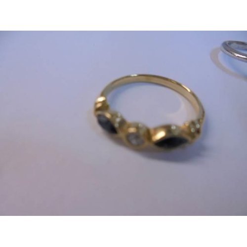 1050 - Two yellow metal rings, a white metal ring and a tiny yellow metal ring.