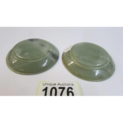 1076 - A small pair of 19th century Chinese jade/stone dishes, 7cm diameter.