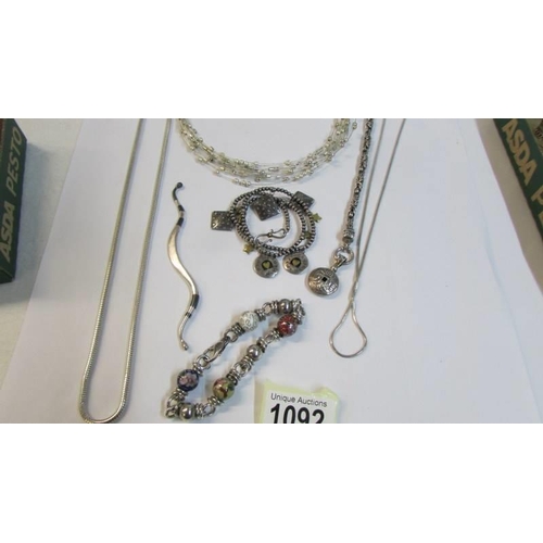 1092 - A quantity of white metal necklaces and bracelets, (possibly silver but not marked).