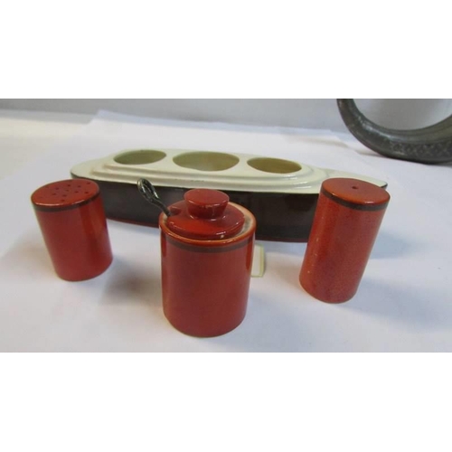 1094 - An art deco ceramic condiment set of an ocean liner, 18 cm long.