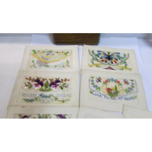 1096 - Eight WW1 silk greeting cards and an olive wood Jerusalem souvenir album.