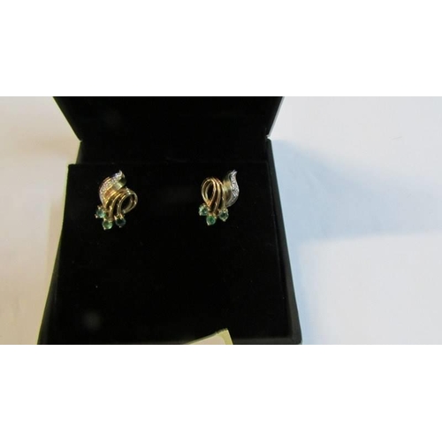 1104 - A pair of 9ct gold diamond and emerald earrings in the style of the 1940's.