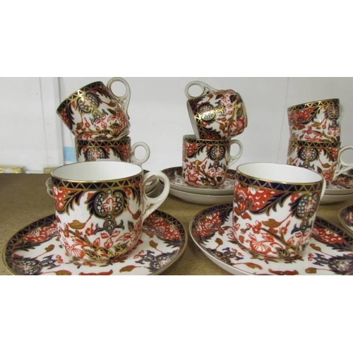 1119 - A set of twelve Royal Crown Derby coffee cans with saucers, (1 cup has hairline crack, 1 cup has fle... 