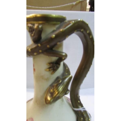 1122 - A fine Royal Worcester porcelain hand painted ewer with dragon handle.