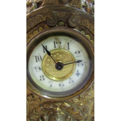 1126 - A French ormolu carriage clock.