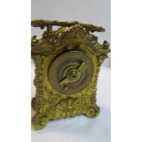 1126 - A French ormolu carriage clock.