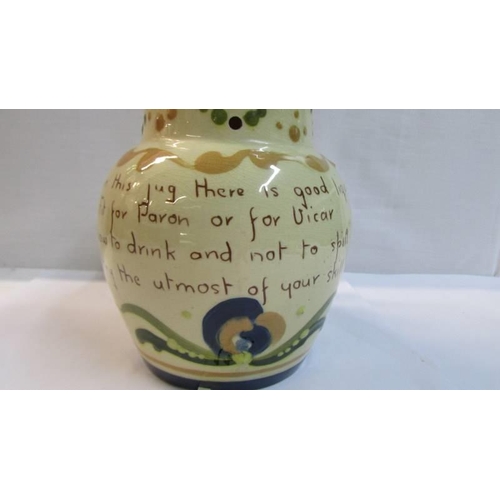 1130 - An early 20th century mottoware puzzle jug.