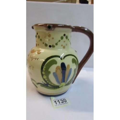 1130 - An early 20th century mottoware puzzle jug.