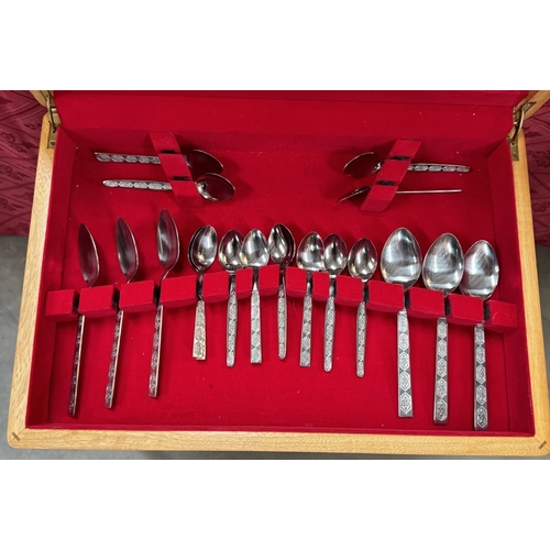 303 - A vintage cutlery table with cutlery & Large quantity of cutlery sets etc. COLLECT ONLY.