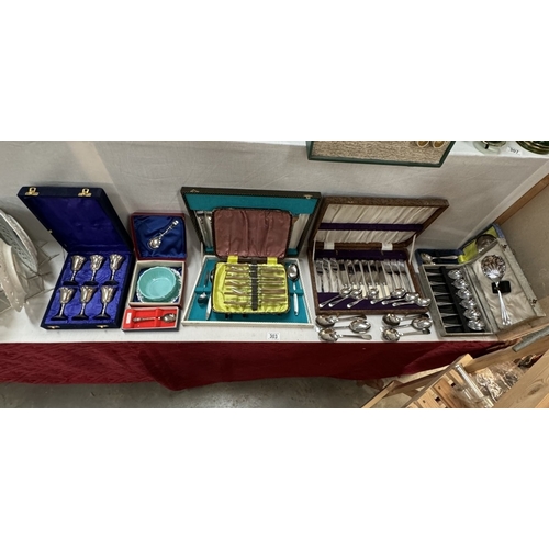 303 - A vintage cutlery table with cutlery & Large quantity of cutlery sets etc. COLLECT ONLY.