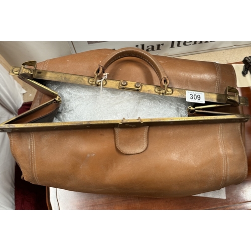 309 - A vintage Gladstone bag