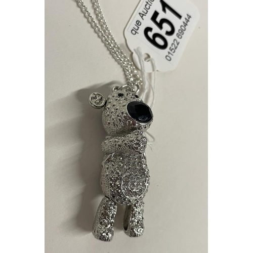 651 - A white metal articulated teddy bear on a long chain.