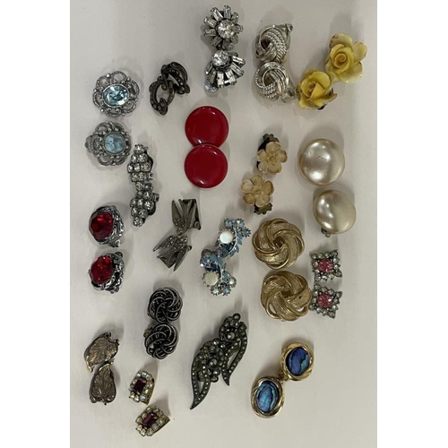 654 - A quantity of clip-on earrings and charms A/F