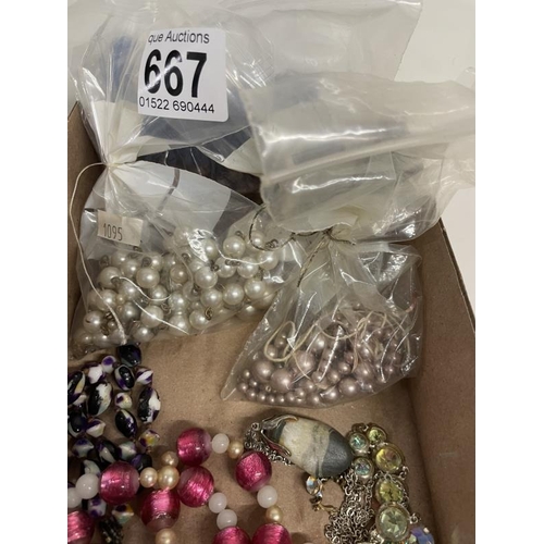 667 - A quantity of necklaces, brooches and loose beads