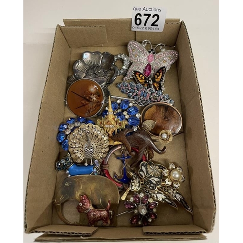 672 - A good lot of costume brooches