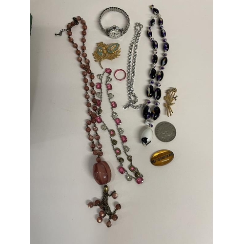 675 - A quantity of miscellaneous necklaces, watches & brooches etc. A/F