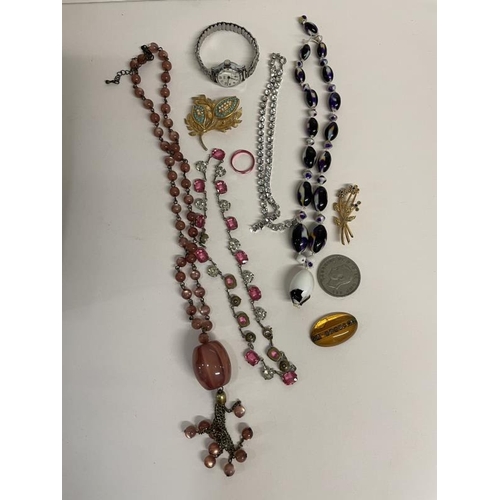 675 - A quantity of miscellaneous necklaces, watches & brooches etc. A/F