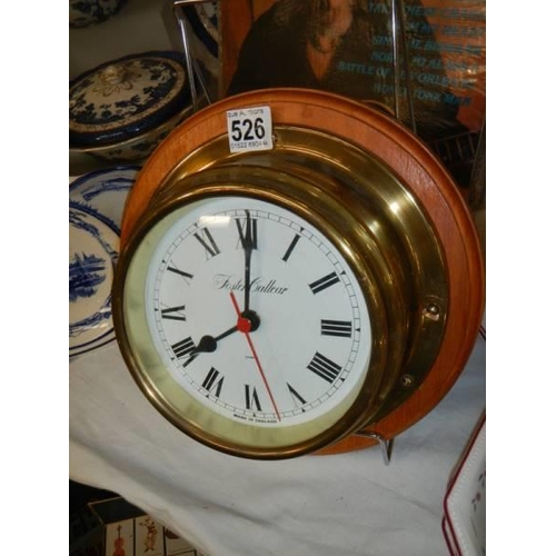 526 - A 20th century battery operated ships clock in working order.