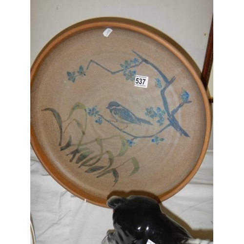 537 - A hand-thrown Cumbrian art pottery charger (Floral and bird decoration).