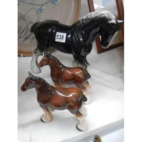 538 - Three ceramic horses.