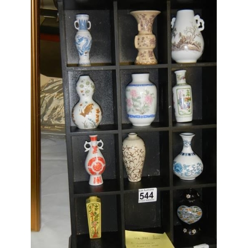 544 - A collection of eleven miniature vases on shelf.  COLLECT ONLY.