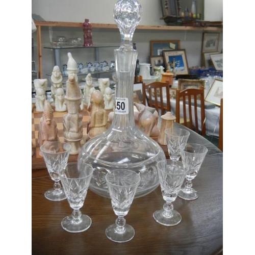 550 - A cut glass decanter and six sherry glasses. COLLECT ONLY.