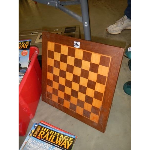 556 - An inlaid chess board.