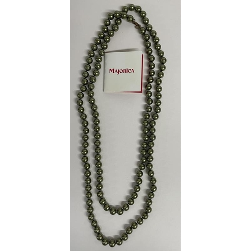 685 - A Majorca green pearl opera length necklace and one other