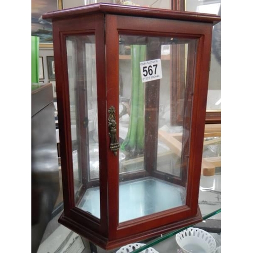 567 - A small mahogany display cabinet. COLLECT ONLY.