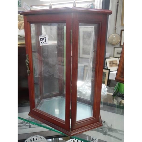 567 - A small mahogany display cabinet. COLLECT ONLY.