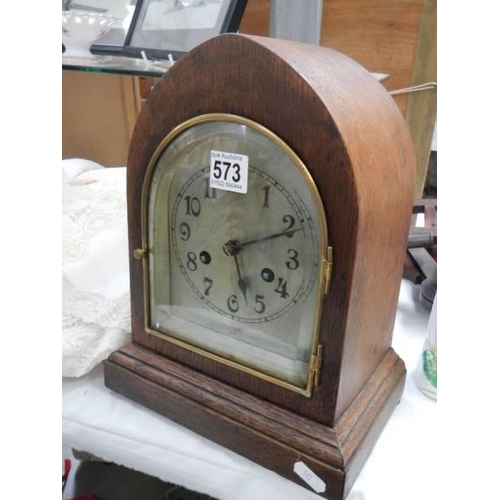 573 - A good eight day mantel clock with silvered dial, in working order. COLLECT ONLY