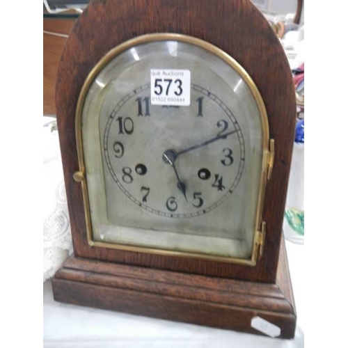 573 - A good eight day mantel clock with silvered dial, in working order. COLLECT ONLY