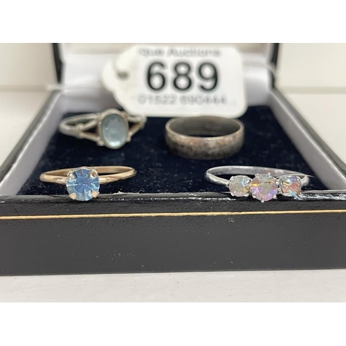 689 - A silver ring and 3 other rings