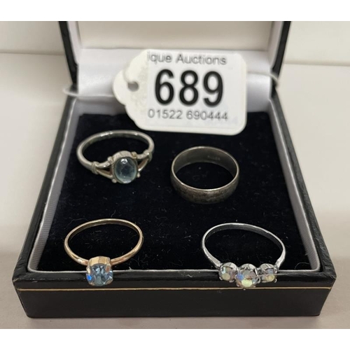 689 - A silver ring and 3 other rings