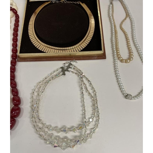 690 - A quantity of necklaces including crystal, pearl etc