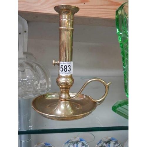 583 - A mid 20th century brass candleholder.