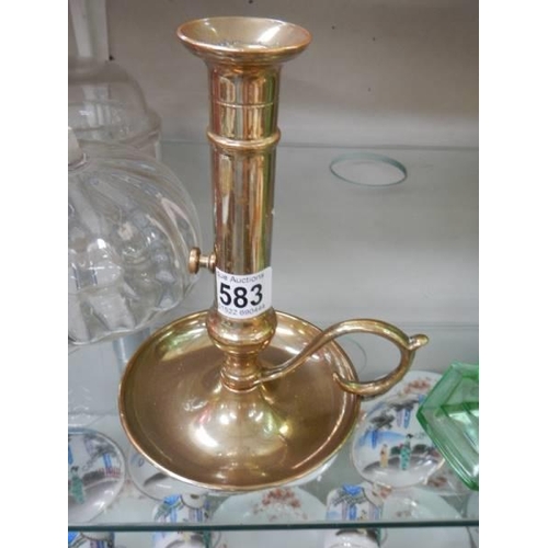 583 - A mid 20th century brass candleholder.